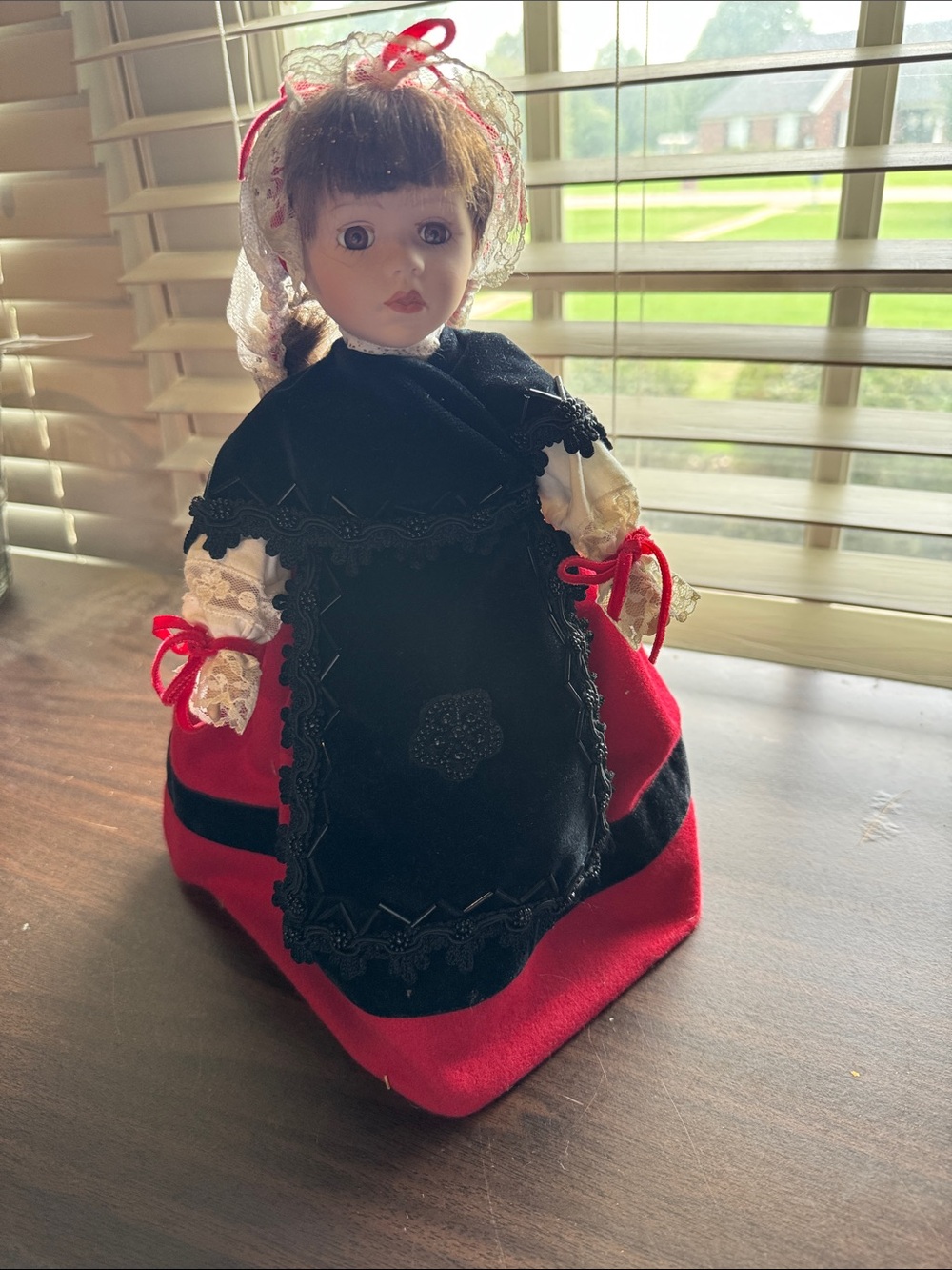 Porcelain Doll in Red and Black Folk Dress with stand